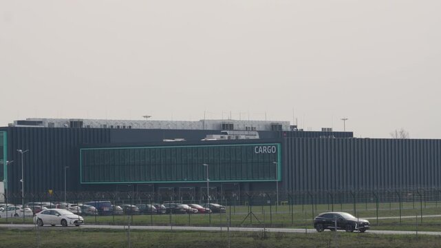 Exploring the sleek cargo facility at sunrise, where the hum of progress meets the promise of adventure