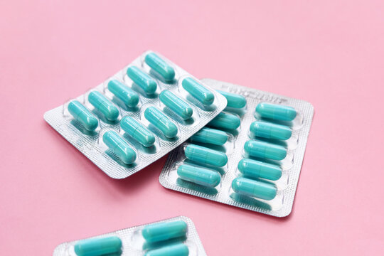 Blue capsules of Doxycycline in blister packs.