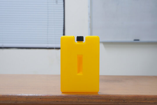 Yellow Ice Pack Ice Bags for therapy on wooden table