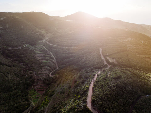 A landscape with a road and valleys among the mountains at sunset, the way to the Masca Gorge, Tenerife island.