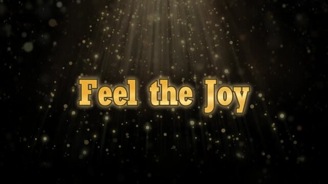 Golden light rays shine on inspirational quotes feel feel the joy on black background with sparkling particles