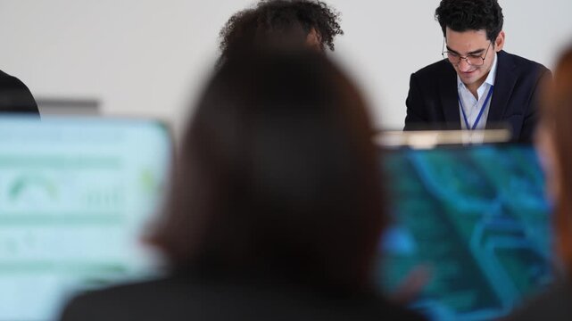 Poised cross functional specialists including african american woman and asian male managing digital safeguard protocols and network security in a sophisticated dark workspace hub.