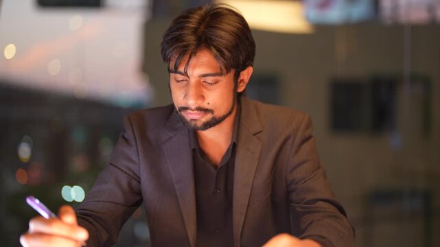 Experienced Indian engineering lead supervising cross border tech operations featuring a panoramic urban skyline at dusk displaying assertive leadership and expertise.