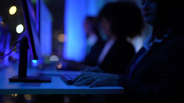 Varied background specialist group including african american woman and asian male optimizing automated trading systems and data flow in a sophisticated dark workspace hub.