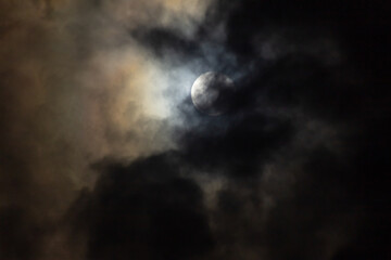 Fototapeta premium The moon in the night sky in the clouds, 