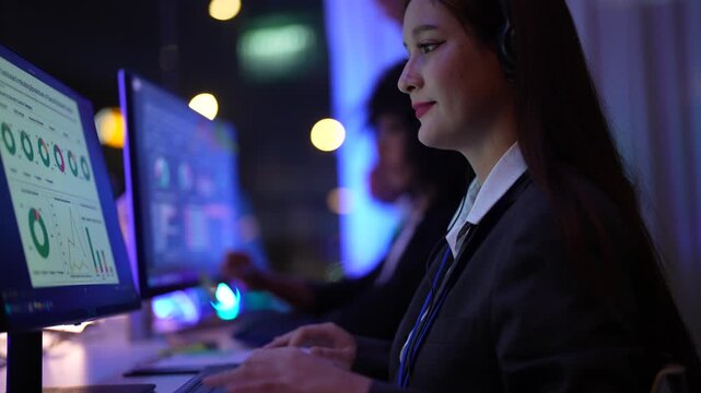 Talented Caucasian female programmer while analyzing neural network architecture on monitor screen at a state of the art command center at night featuring immersive neon blue monitor glow effects.