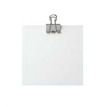 Small silver paperclip holding blank sheets of paper together