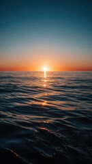 Fototapeta premium Sunset Over Calm Ocean Horizon
