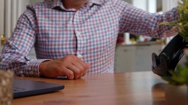 Hands skillfully arrange and count fresh banknotes in a sunny office setting, creating a rhythmic sound as bills slide and shuffle with intention and precision