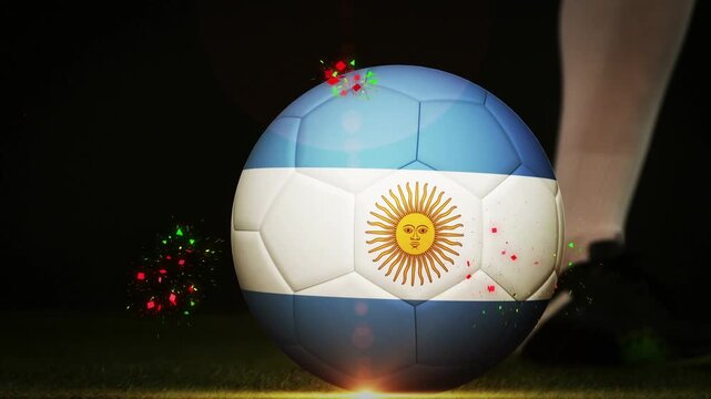 Soccer player stepping and kicking Argentina-flag ball, cleat sparking particles for sports promo