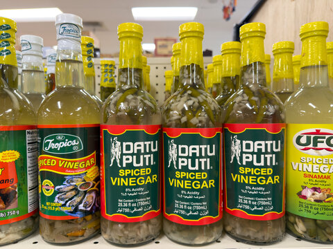 Datu Puti Spiced Vinegar Bottles Filipino Condiment Grocery Shelf