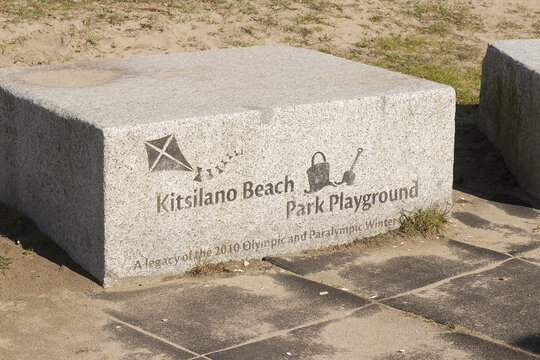 Engraved granite legacy marker for Kitsilano Beach Park Playground from the 2010 Olympic and Paralympic Winter Games at Kits Beach.