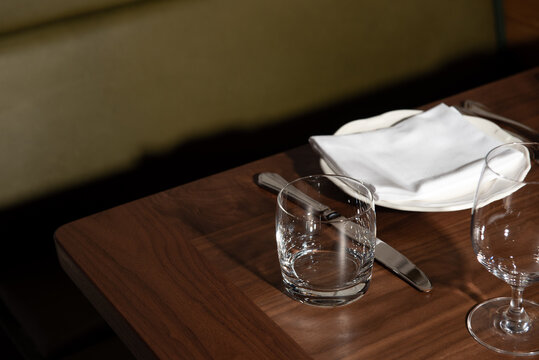 Edge of Table and Place Setting in Restaurant 