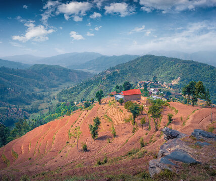 Wonderful summer view of colorful valley nestled in the heart of Nepal&rsquo;s mountains. Picturesque evening scene of terraced fields cascade down, Nepal, Asia. Beauty of countryside concept background.