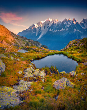 Majestic autumn sunrise on Lac Blanc lake with Mont Blanc (Monte Bianco) on background, Chamonix location, France, Europe. Beautiful outdoor scene of Graian Alps. Beauty of nature concept background.