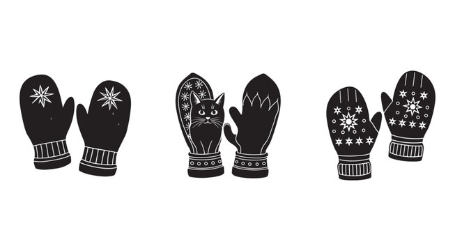 Set of black winter mittens with white snowflake patterns on white background