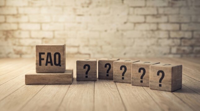 Faq word on wooden blocks with question marks, frequently asked questions concept.
