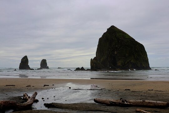 Haystack Rock rises above the chilly Pacific Ocean near Cannon Beach, Oregon