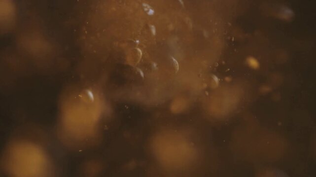 Brown Background with Blurry Orange Spots.