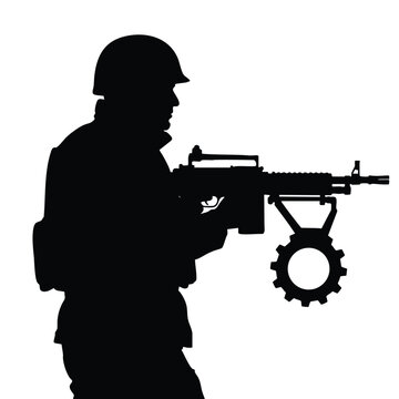 Silhouette of a Soldier Holding a Rifle with Gear Ready for Action