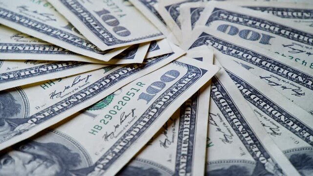 Crisp banknotes dance together, creating a stunning tapestry of green. Each bill tells a story of value as they lie gracefully, inviting admiration and curiosity