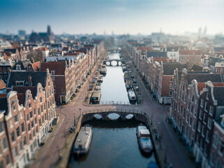 Obraz premium Dutch Canal City with Houseboats and Gabled Buildings Aerial Miniature