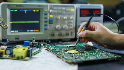 Electronics technician, electronic engineering electronic repair,electronics measuring and testing, repair and maintenance concepts.  © Teerapong23