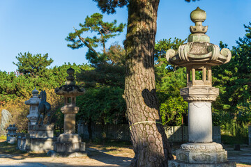 Obraz premium Stone lantern donated by Imari merchants at Tsunashiki Tenjin Shrine (Shin Tenjin) in Imabari, Ehime, Japan.