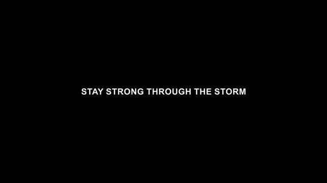 Stay strong through the storm minimal motivational typography on black background.