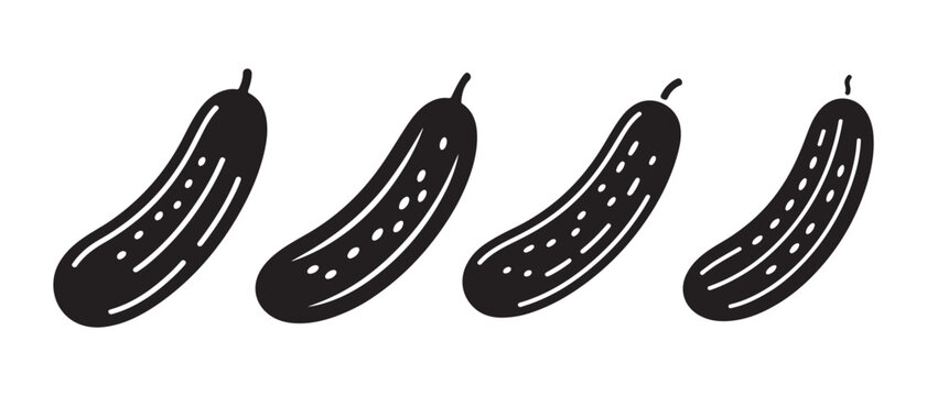 Black and White Cucumbers in a Row on White Background.