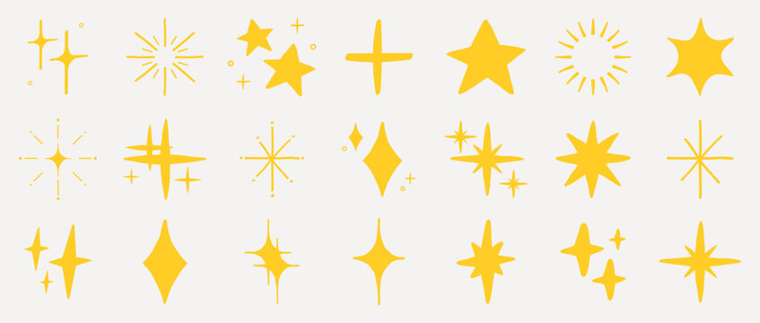 Yellow star and sparkle icons in various shapes and sizes. Star and sparkle designs include stars, bursts, and crosses. Decorative star and sparkle elements. Yellow doodle stars.