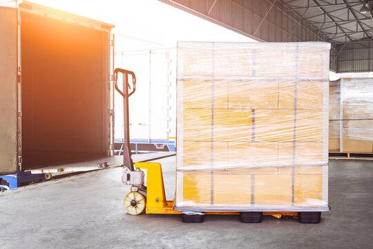Bulk of package boxes shipment. Goods awaiting loading into containers trucks. Carton, CardBoard Boxes. Distribution Warehouse, Shipping Cargo Container. Freight Transportation,Truck Logistics.