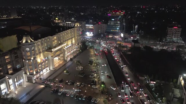 Raipur city night aerial view, Urban night traffic and skyline, City lights and busy road at night, Raipur downtown illuminated streets stock video.