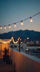 Fototapeta premium String Lights on Rooftop with Evening City View