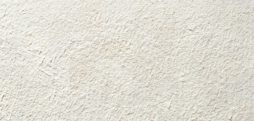 Fototapeta premium A close-up view of a textured surface with a light coloration, showcasing intricate patterns and subtle details for artistic or design purposes.