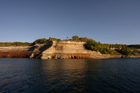 Sunset over Pictured Rocks National Lakeshore colorful sandstone