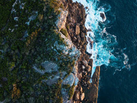 Top down view of ocean cliff.