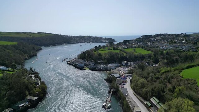 Fowey, Cornwall, England: DRONE VIEWS: The northern part of the town of Fowey (right) with the car ferry stationary at Bodinnick (left). Cornwall is a popular UK holiday destination.