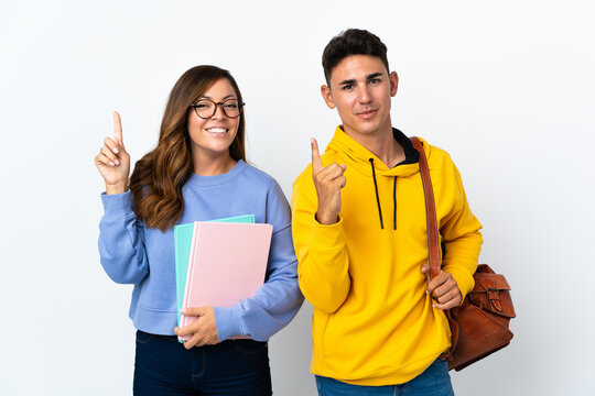 Young student couple isolated on white background intending to realizes the solution while lifting a finger up