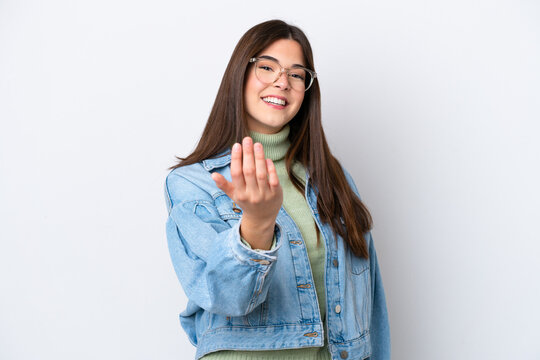 Young Brazilian woman isolated on white background inviting to come with hand. Happy that you came