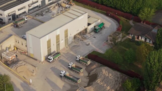 Aerial view of a concrete production facility in the Milan metropolitan area. Industrial infrastructure node supporting construction supply chains and urban development across northern Italy.