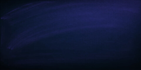 A dark grunge blue chalk board texture with a rough denim fabric pattern and light weathered canvas surface for a textured wallpaper backdrop © Faysal