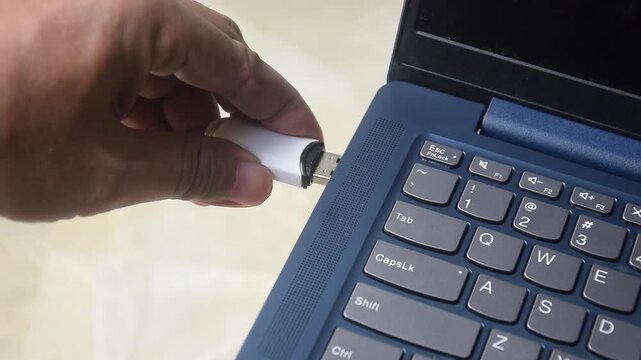 Flash drive is connected to the laptop via the USB port	