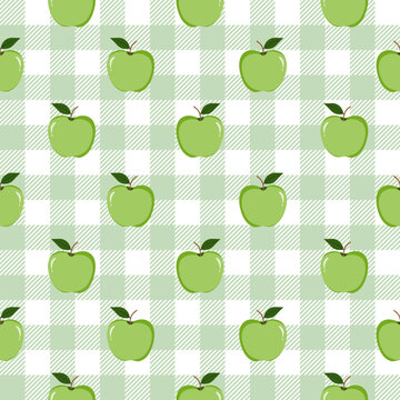 Seamless pattern with green apples on a soft green and white checkered gingham backdrop.