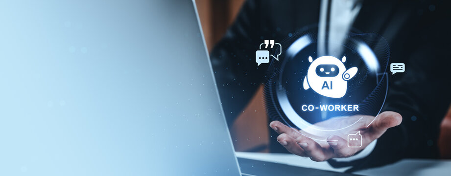 Business hand presenting glowing ai co worker icon with digital chat symbols in futuristic tech concept sphere above laptop in modern workspace.