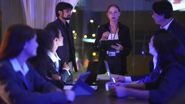 Systems architect reviewing analytical dashboards inside a sophisticated dark workspace hub with immersive neon blue monitor glow and professional cinematic lighting effects during night shift.