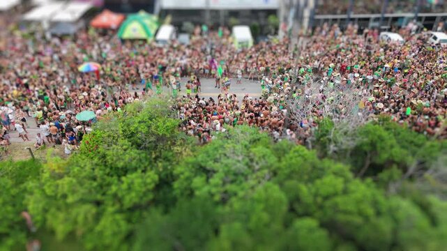 Aerial view of the street block carnival named Samambloco on the street of the town of Campeche, Florianopolis, Brazil