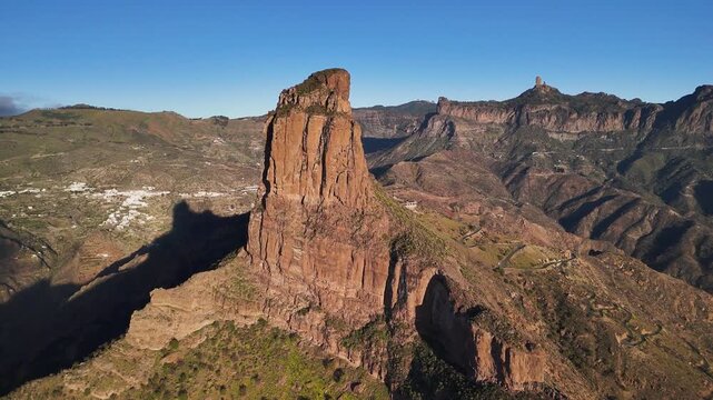 Aerial view on Roque Bentayga on the island Gran Canaria in Spain with the famous landmark Roque Nublo in the background.