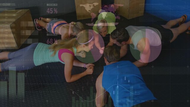 Vertical video: Coach cueing group holding plank circle, facing while charts rising for fitness
