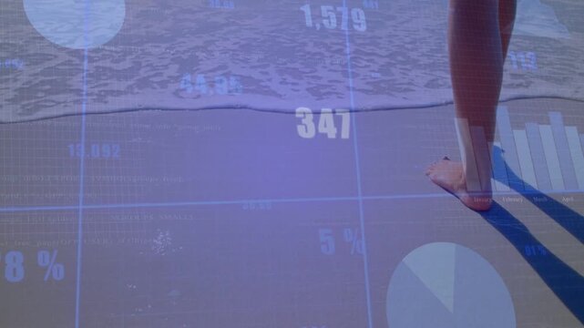 Small waves lapping feet, barefoot woman walking shore, leaving prints while showing data overlays